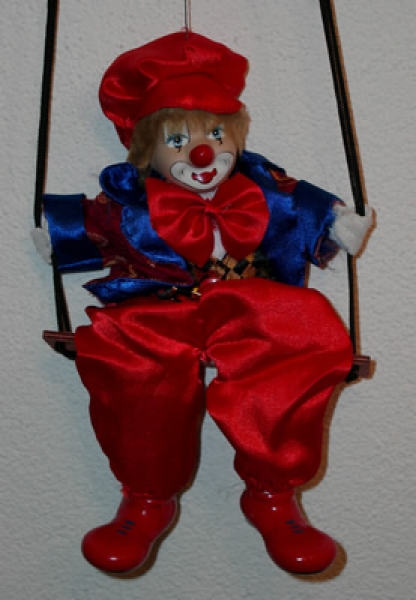 Porzellan Clown auf Schaukel